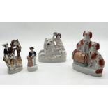 A collection of Staffordshire figures including "The Peaceable Kingdom" of lady, lion and lamb, pair