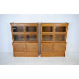 A pair of 'The "Oxford" sectional bookcases' by 'W. M. Baker & Co Ltd' - length 88cm, depth 32cm,