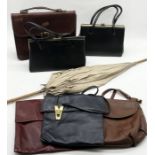 A collection of vintage leather handbags and parasol