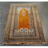 An Eastern brown ground prayer rug - 148cm x 94cm