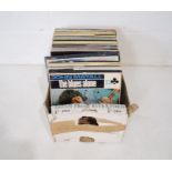 A quantity of 12" vinyl records including Eric Clapton, John Mayall, Oscar Peterson Trio, The