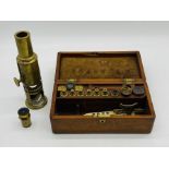 A 19th century field microscope in mahogany case, the brass body inscribed "West, Fleet Street,