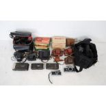A collection of vintage cameras including Miranda Sensorex, Olympus OM10, Olympus Trip 35, Petri