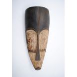A carved wooden African tribal Fang Ngil mask of Gabon - height 46cm