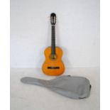 A Kapok Brand Spanish classical guitar with soft carry case