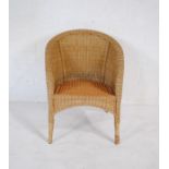 A wicker tub chair