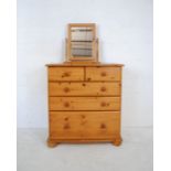 A modern pine chest of five drawers along with a dressing table mirror - length 83cm, depth 49cm,