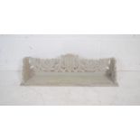 A small carved wooden wall shelf - length 61cm