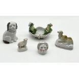 A collection of antique china including Staffordshire lamb, camel and penny bank, a continental pair