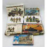 A collection of boxed vintage army plastic construction kits and figures including a Sanwa Buffalo