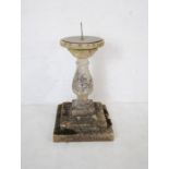 A weathered reconstituted stone sectional sun dial - height 76cm