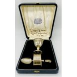 A cased hallmarked silver Christening set consisting of egg cup, serviette ring and spoon