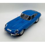 An unboxed Jaguar E-Type (1:8 scale) plastic car model in light blue