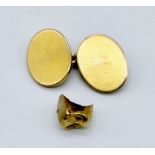 A single 15ct gold cufflink (5.4g) along with dental gold (tests as 14ct gold- total weight 1.4g)