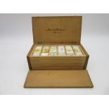 A Victorian set of microscope slides in fitted pine case