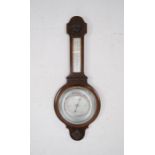 An oak banjo barometer with carved detailing - height 76cm