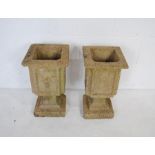 A pair of reconstituted stone planters - length 26cm, height 45cm