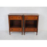 A pair of 'Reprodux' bedside cabinets with two drawers and reeded decoration