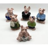 A set of six Wade NatWest ceramic piggy banks with stoppers including cousin Wesley