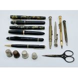 A collection of vintage pens and pencils including Waterman's, Mentmore and Parker along with two