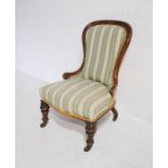 A Victorian upholstered nursing chair raised on turned legs with stamp to castors reading 'Copes