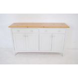 A part painted pine sideboard with two drawers and two cupboards under - length 152cm, depth 46cm,