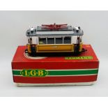 A boxed Lehmann L.G.B. G scale four wheeled tram/street car in yellow and white with passengers (