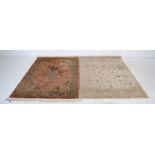 An Eastern style beige ground rug along with one other - approx. 169cm x 120cm each