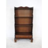 A waterfall bookcase with single drawer - length 60cm, depth 30cm, height 114cm
