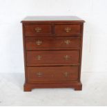 A small mahogany chest of five drawers - length 55cm, depth 38cm, height 68cm