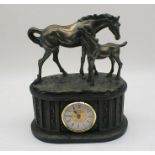 A classical style clock with horse and foal decoration . Height approximately 30cm.