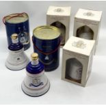 A collection of five boxed Bell's Wade decanters