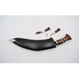 A kukri knife with leather scabbard (A/F)