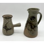 A David Leach jug with single handle (16cm height) along with a similar style jug by Bryan Newman
