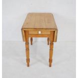 A Victorian pine Pembroke table with single drawer with ceramic handle, raised on turned legs