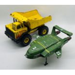 A vintage Tonka turbo-diesel tipping truck, along with a Thunderbirds 2 toy vehicle.