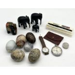A collection of elephants, decorative eggs, pocket watch etc.