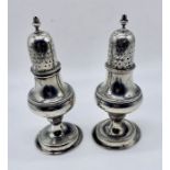 A pair of antique hallmarked silver pepperettes, total weight 195.5g
