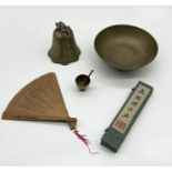 A small collection of Eastern brass including a bell, bowl etc along with a boxed wooden fan