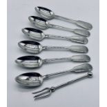 A set of six hallmarked silver tea spoons along with a silver pickle fork, total weight 107.1g