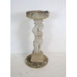 A reconstituted stone sectional bird bath with cherub decoration - height 98cm