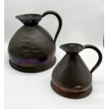 A large Bate 4 gallon copper measuring jug along with smaller gallon example both marked to top