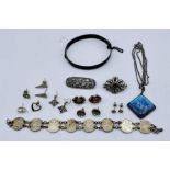 A small collection of silver jewellery including a bangle, pendants etc.