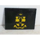 A cast iron fireback decorated with coat of arms and the motto "In god is my trust" 54cm x 40cm