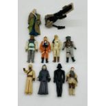 A collection of nine Star Wars figurines including Darth Vader, Tusken Raider (both dated 1977),
