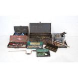 A quantity of various tools contained within metal tool boxes including ratchet/socket sets, various