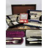A collection of silver plated cutlery, servers etc along with a Maple & Co. oak canteen