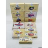 A collection of twelve boxed Corgi "Commercials" die-cast model buses and van including two
