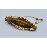 A 9ct gold Victorian brooch set with a small diamond, weight 4.2g