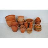 A quantity of terracotta garden pots